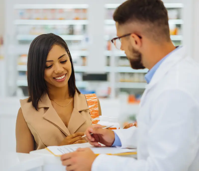 Pharmacist helping a patient